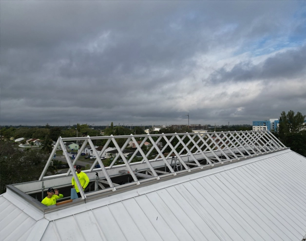 Workers installing skylight